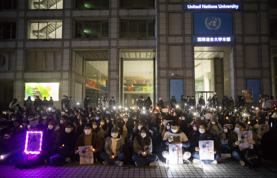 People attend a demonstration organized by a group called "WeLoveMyanmar" to protest against the Myanmar military's recent coup in front of the United Nations University in Tokyo on Thursday, Feb. 11, 2021. (AP Photo/Hiro Komae)