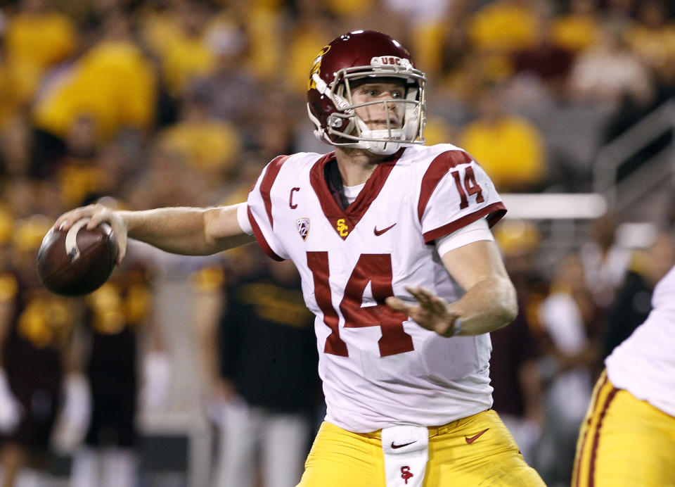 FILE – In this Saturday, Oct. 28, 2017 file photo, Southern California quarterback Sam Darnold throws a pass during the first half of an NCAA college football game against Arizona State in Tempe, Ariz. Southern California quarterback Sam Darnold will skip his final two seasons of eligibility to enter the NFL draft. (AP Photo/Ralph Freso, File)