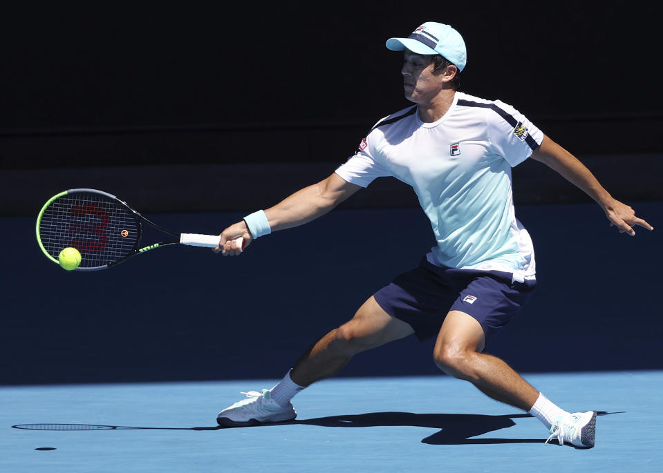 United States' Mackenzie McDonald hits a forehand to Russia's Daniil Medvedev during their fourth round match at the Australian Open tennis championships in Melbourne, Australia, Monday, Feb. 15, 2021. (AP Photo/Hamish Blair)