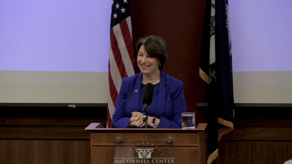 U.S. Sen. Amy Klobuchar smiles while presenting her lecture: "When Businesses Compete, America Wins: Rejuvenating America's Antitrust Policy," at the McConnell Center at the University of Louisville. April 11, 2022