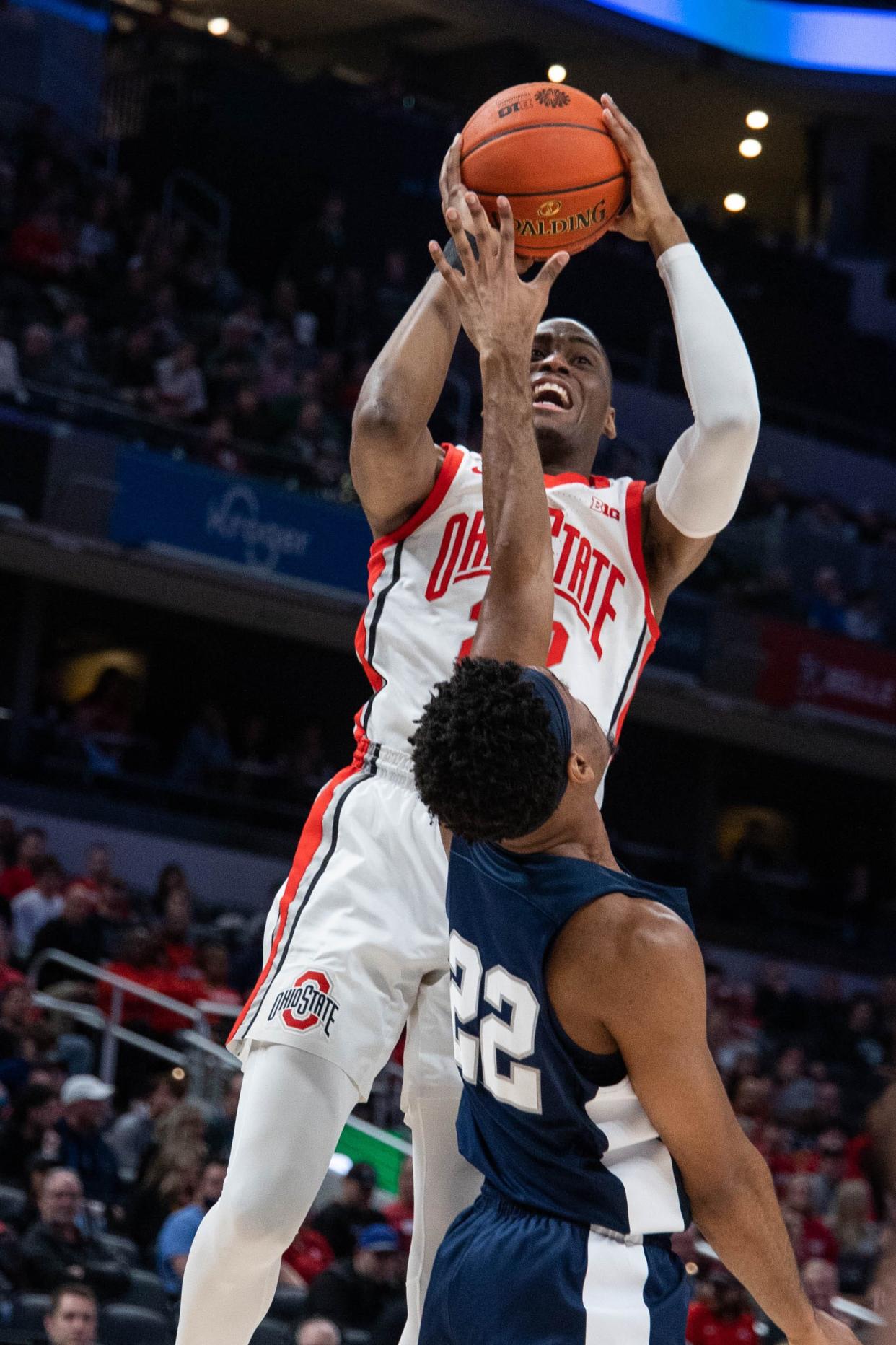 Mar 10, 2022; Indianapolis, IN, USA; Ohio State Buckeyes guard Malaki Branham (22) shoots the ball while Penn State Nittany Lions guard Jalen Pickett (22) defends  in the first half at Gainbridge Fieldhouse. Mandatory Credit: Trevor Ruszkowski-USA TODAY Sports