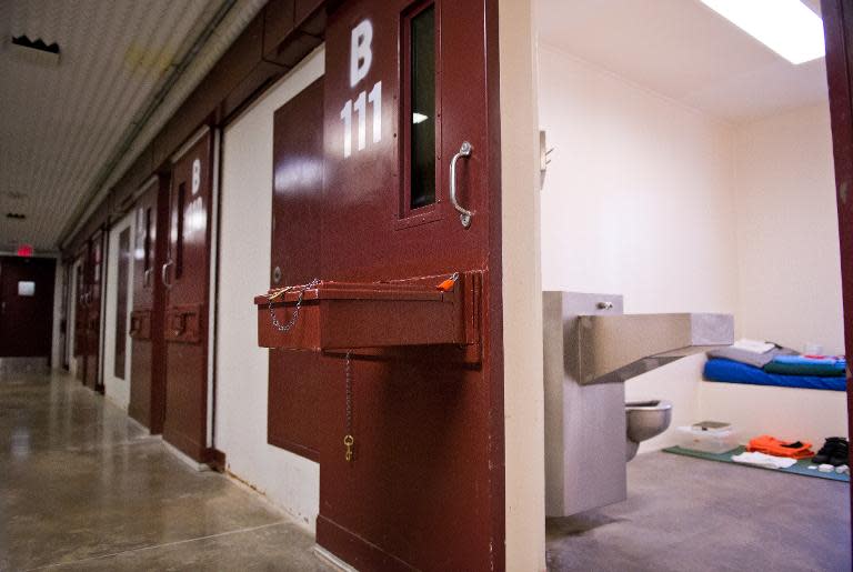 This photo made during an escorted visit and reviewed by the US military shows the corridor and the cell's doors of "Camp 5" detention facility at the US Naval Station in Guantanamo Bay, Cuba, April 8, 2014