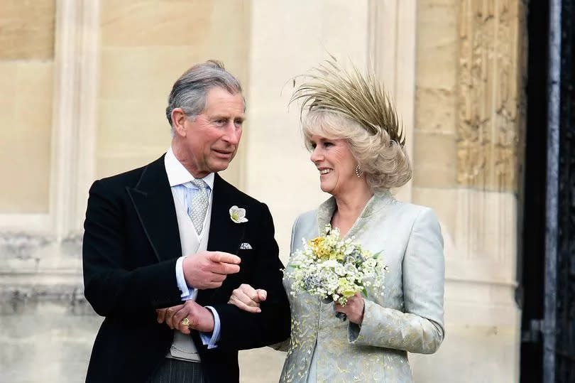 TRH the Prince of Wales, Prince Charles, and The Duchess Of Cornwall, Camilla Parker-Bowles in silk dress by Robinson Valentine and head-dress by Philip Treacy, leave the Service of Prayer and Dedication blessing their marriage at Windsor Castle on April 9, 2005 in Berkshire, England.