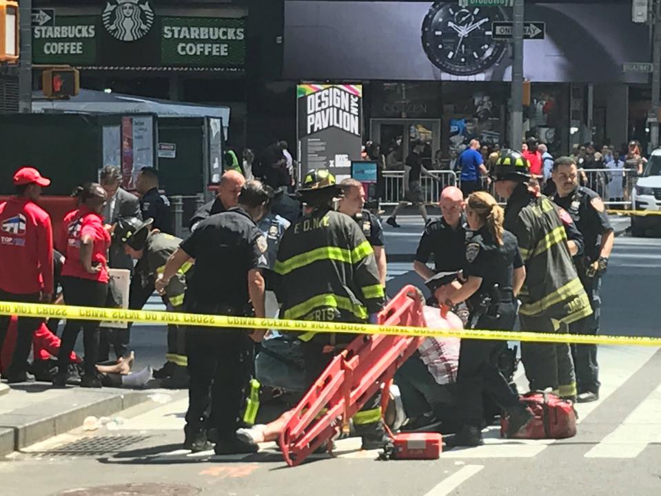 Emergency services attend the scene in Times Square where a car has struck pedestrians, killing one (Reuters)