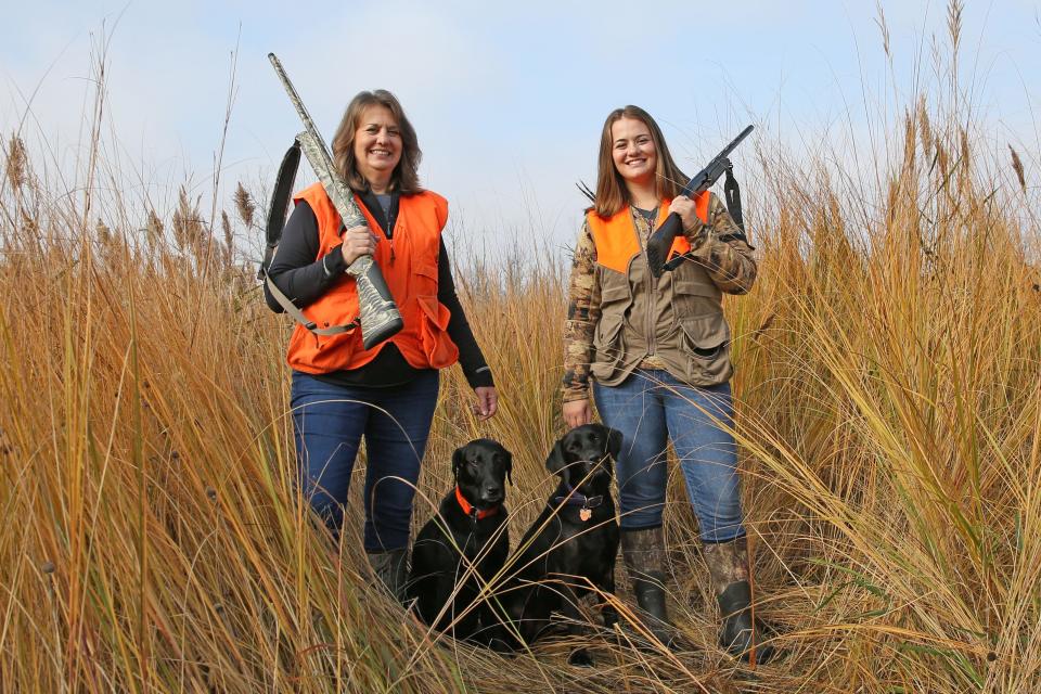 Kelly Schott, left, and her daughter Sarah Schott, both wildlife communications specialists for the Ohio Department of Natural Resources, hunt together at Pickerel Creek Wildlife Area in Sandusky County. Joining them on the hunt are their dogs Tippy and Retta.