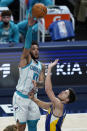 Charlotte Hornets' Miles Bridges (0) shoots over Indiana Pacers' Doug McDermott (20) during the first half of an NBA basketball Eastern Conference play-in game Tuesday, May 18, 2021, in Indianapolis. (AP Photo/Darron Cummings)