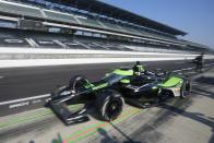 Agustin Canapino, of Argentina, leaves the pits during a practice session for the Indianapolis 500 auto race at Indianapolis Motor Speedway, Thursday, May 16, 2024, in Indianapolis. (AP Photo/Darron Cummings)