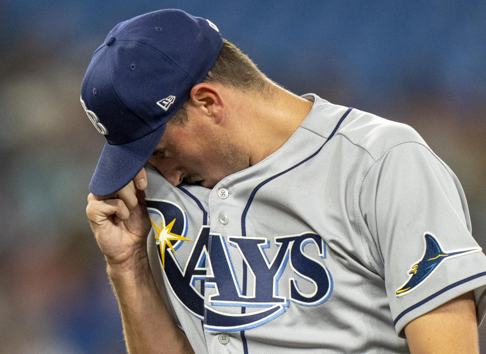 Tampa Bay Rays starting pitcher Cooper Criswell (71) walks off the mound after being pulled during fourth inning of a baseball game against the Toronto Blue Jays, in Toronto, Monday, Sept. 12, 2022. (Frank Gunn/The Canadian Press via AP)
