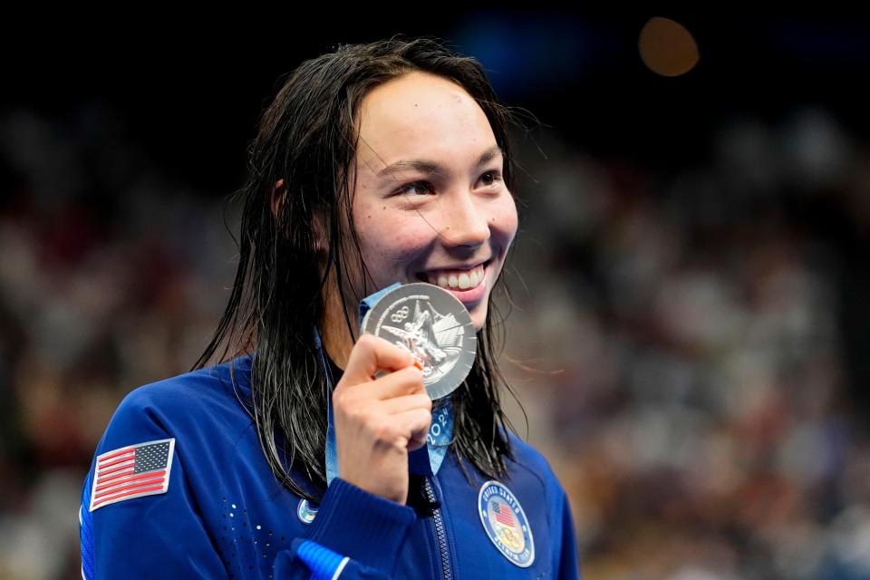 American Torri Huske shows off her silver medal in the women’s 100-meter freestyle during the 2024 Paris Olympics.