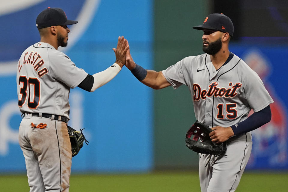 Detroit Tigers' Nomar Mazara, right, and Harold Castro celebrate after the Tigers defeated the Cleveland Indians 9-4 in the first baseball game of a doubleheader Wednesday, June 30, 2021, in Cleveland. (AP Photo/Tony Dejak)