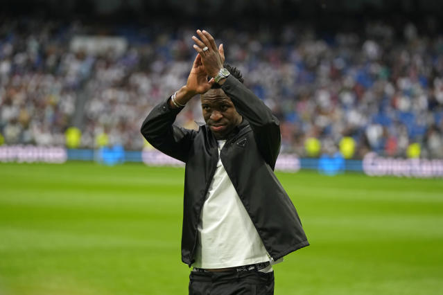 Real Madrid's Vinicius Junior applauds to spectators prior to a Spanish La Liga soccer match between Real Madrid and Rayo Vallecano at the Santiago Bernabeu stadium in Madrid, Spain, Wednesday, May 24, 2023. (AP Photo/Manu Fernandez)