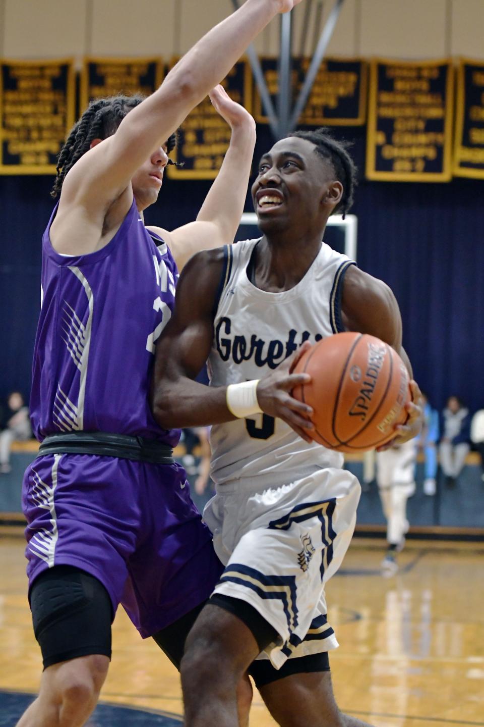 St. Maria Goretti's Dionte Alexander goes to the basket against Mount St. Joseph during the Gaels' 54-52 victory in January.
