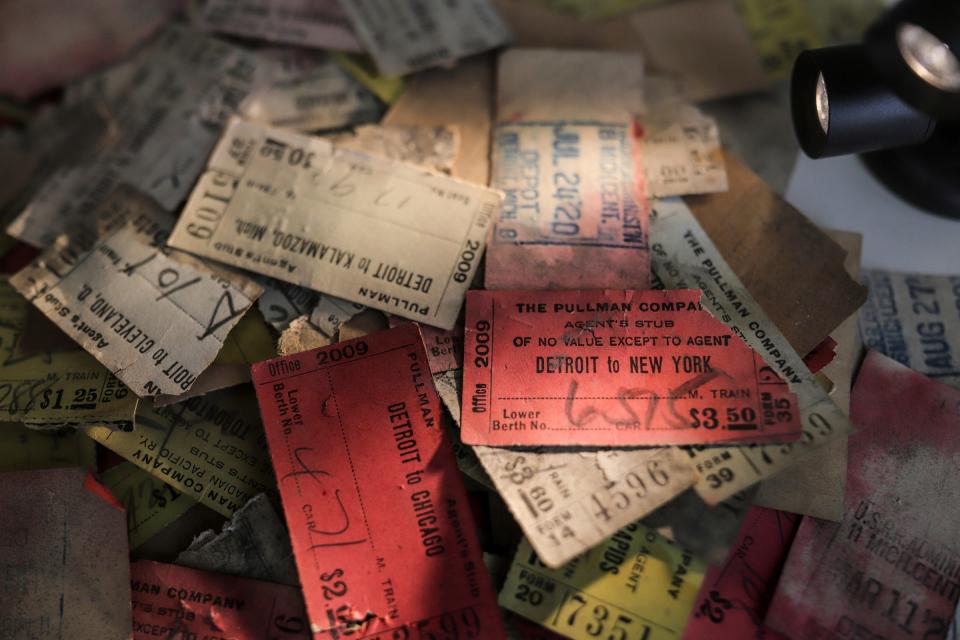 A stack of train ticket stubs sit on display for people to look at while taking a self-guided tour of the first floor of the Michigan Central Station for the “Summer at the Station” on Friday, June 21, 2024 in Detroit.