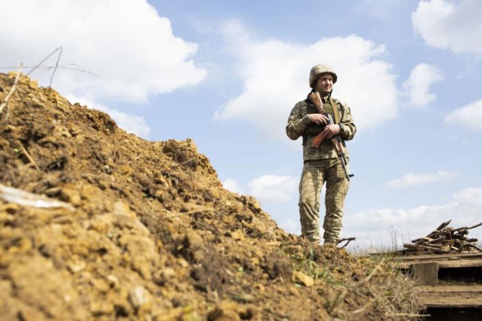 <div class="inline-image__caption"><p>A Ukrainian soldier stands near the front line, looking toward territory controlled by the Russian-backed separatists.</p></div> <div class="inline-image__credit">Emil Filtenborg</div>