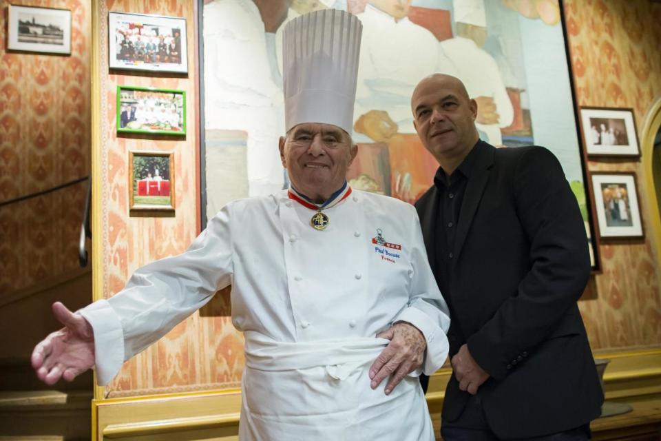 French chef Paul Bocuse (L) and his son Jerome Bocuse (R) pose on the premises of the three-Michelin star restaurant L'Auberge du Pont de Collonges, in Lyon, France (EPA)