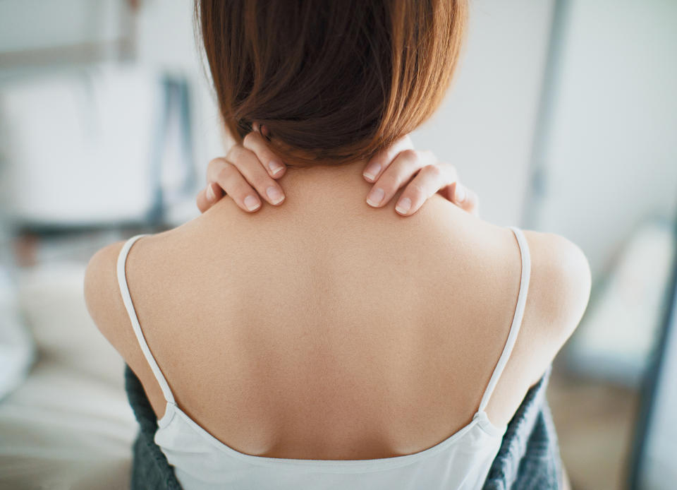 Rear View Of Young Woman At Home (Getty Images stock)