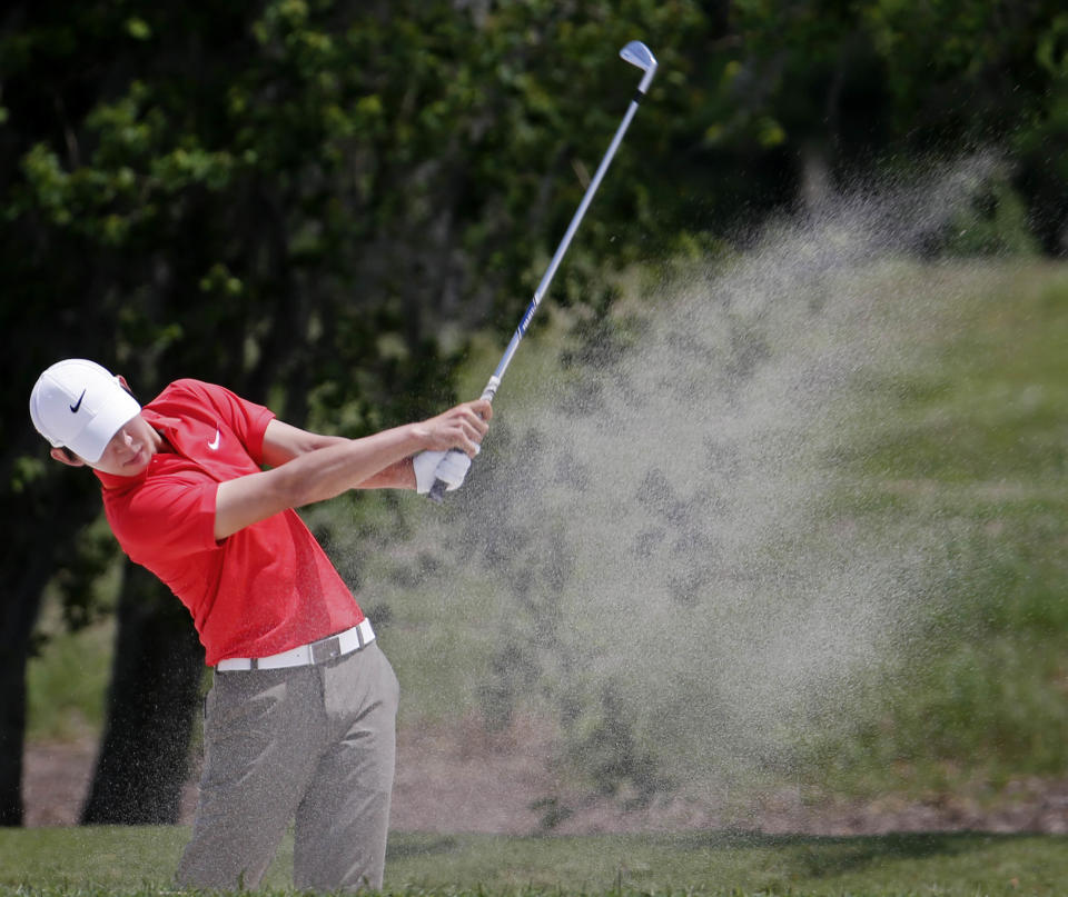 Noh Seung-yul, of South Korea, hits out of the sand on the second fairway during the final round of the Zurich Classic golf tournament at TPC Louisiana in Avondale, La., Sunday, April 27, 2014. (AP Photo/Bill Haber)