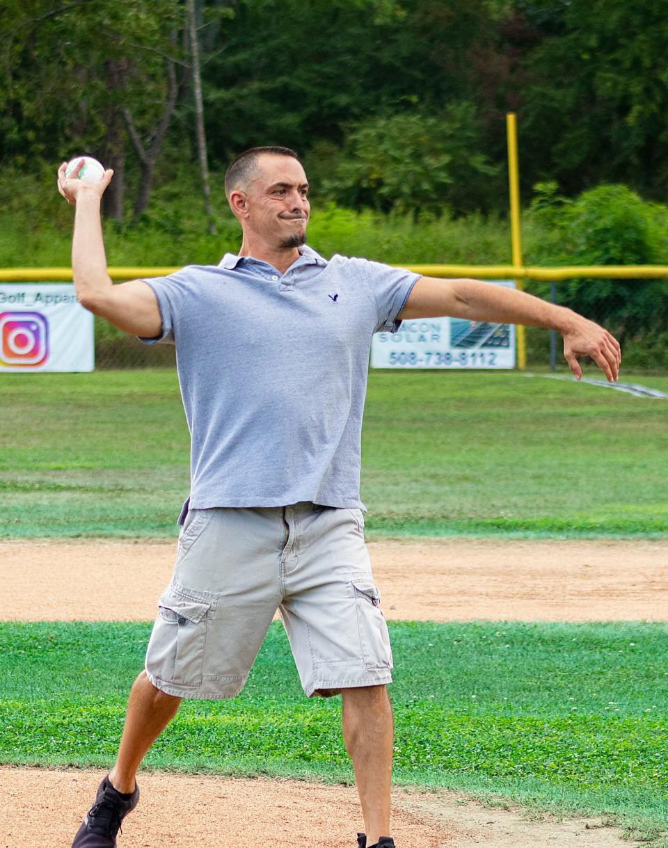 Town resident, retired Massachusetts Army National Guard First Sergeant, and Purple Heart recipient Sean Comiskey threw out the ceremonial first ball for the softball game, at Purple Heart Day held Friday, Aug. 5, 2022 at Swansea Memorial Park.