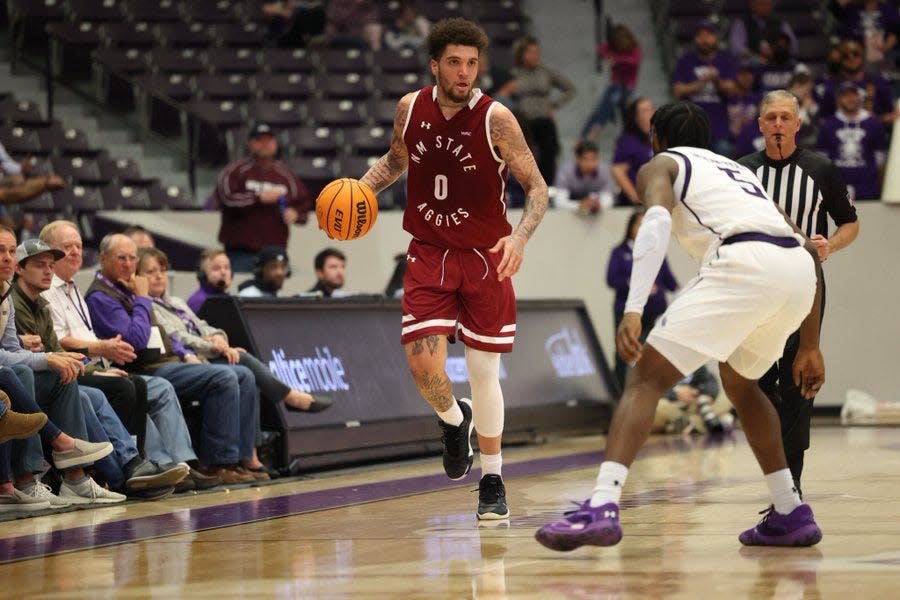 Teddy Allen brings the ball across half court against Stephen F. Austin Saturday, Jan. 22, 2022.