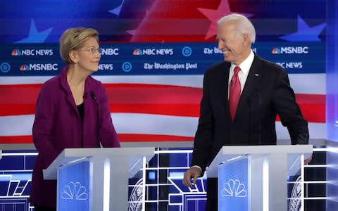 Joe Biden, left, the former US vice president, continues to lead in the polls while senator Elizabeth Warren has dropped markedly - Credit: Photo by Alex Wong/Getty Images