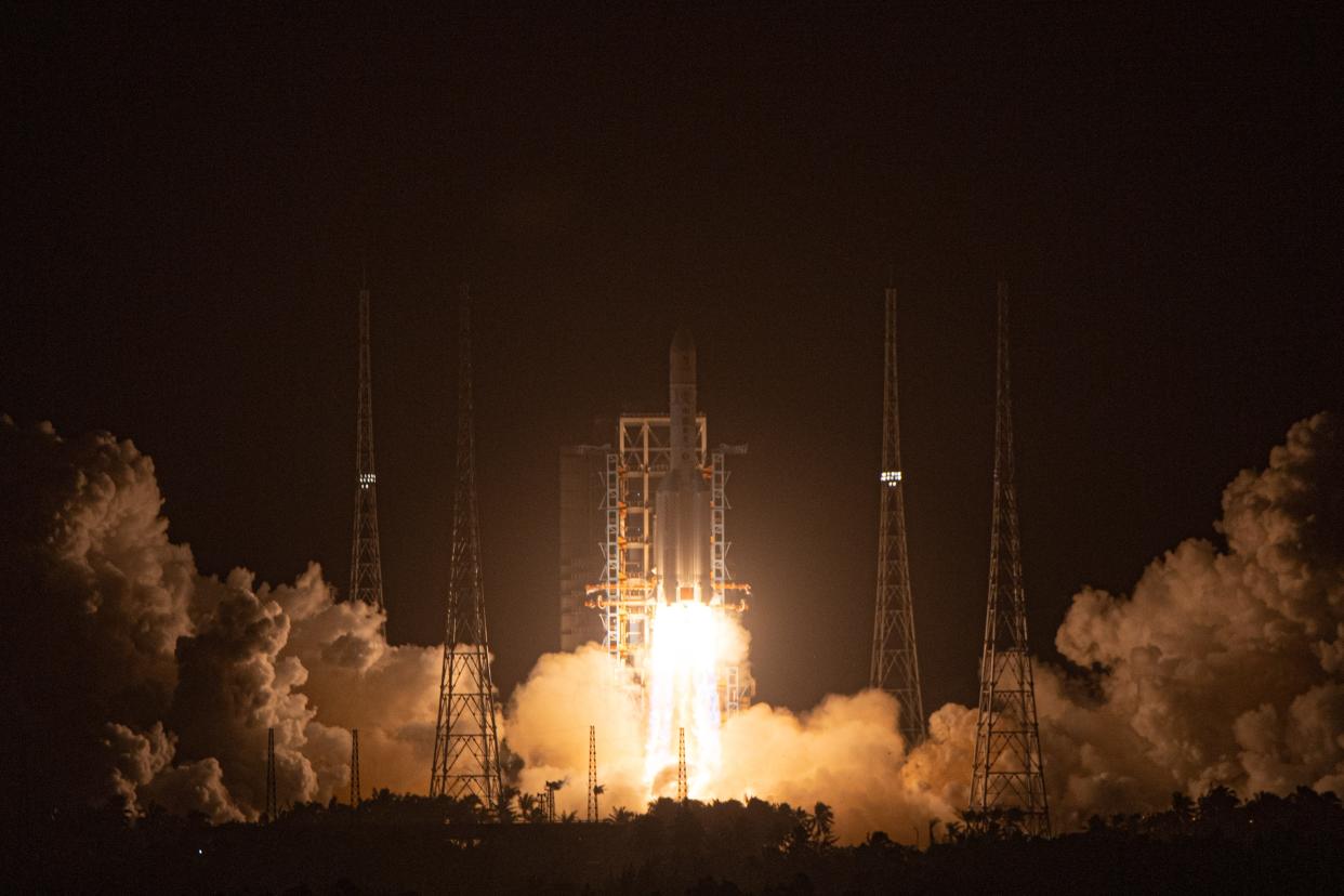 A Long March-5 rocket, carrying the Chang'e-5 spacecraft, blasts off from the Wenchang Spacecraft Launch Site on the coast of southern island province of Hainan, Nov. 24, 2020.