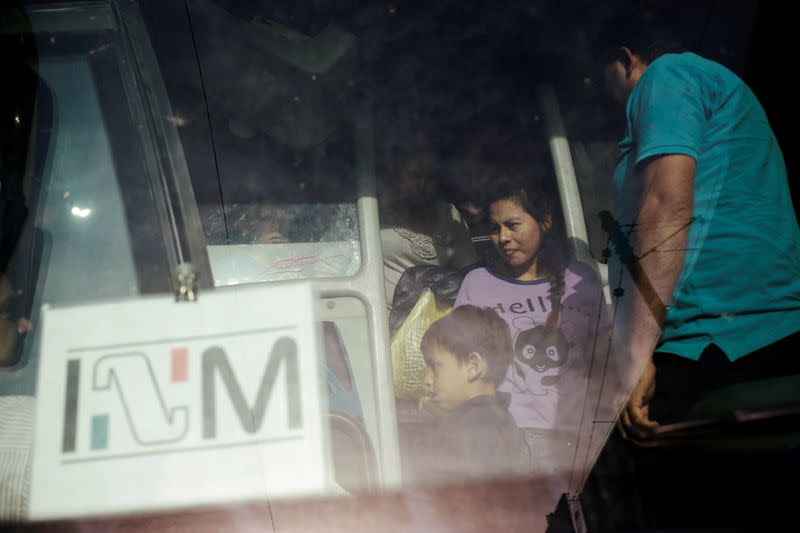 FILE PHOTO: Central American migrants, returned from the U.S. to Nuevo Laredo in Mexico under the Migrant Protection Protocol to wait for their court hearing for asylum seekers, are seen arriving to Monterrey