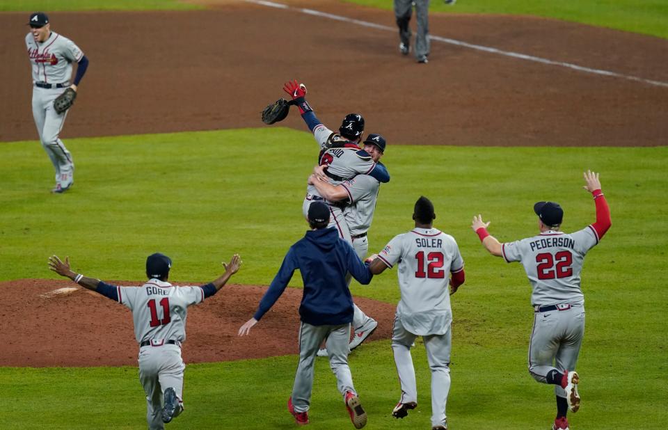 Braves players celebrate the final out of the World Series against the Astros.