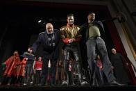 Inmates take a bow after performing in the State of Siege, by French author Albert Camus, a play describing the arrival of plague in Spain which brings a totalitarian regime to power, at the Nottara Theatre in Bucharest, Romania, Wednesday, Nov. 24, 2021. Performing on the main stage of the reputed Nottara Theatre downtown Bucharest is a dream opportunity for any Romanian aspiring artist – getting to do that as a convicted inmate is a breakthrough. (AP Photo/Andreea Alexandru)