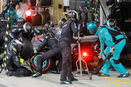 Formula One - F1 - Abu Dhabi Grand Prix - Yas Marina Circuit, Abu Dhabi, United Arab Emirates - November 26, 2017. British Formula One driver Lewis Hamilton of Mercedes AMG GP in the pit stop. REUTERS/Valdrin Xhemaj/Pool