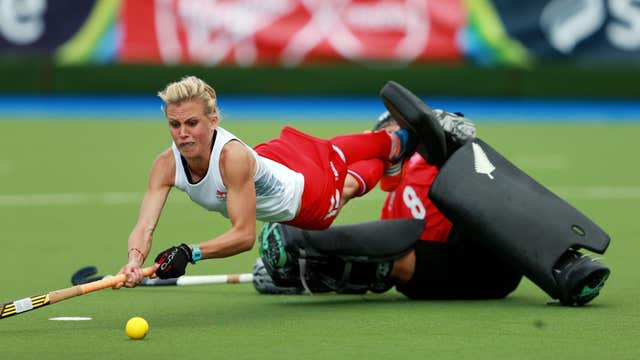 Alex Danson-Bennett dives over a goalkeeper to shoot