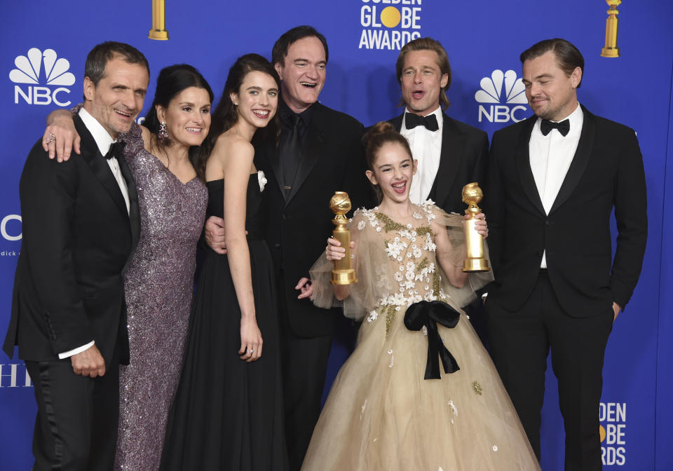 The cast and crew of "Once Upon a Time in Hollywood" pose in the press room with the awards for best motion picture, musical or comedy and best screenplay, motion picture, at the 77th annual Golden Globe Awards at the Beverly Hilton Hotel on Sunday, Jan. 5, 2020, in Beverly Hills, Calif. (AP Photo/Chris Pizzello)