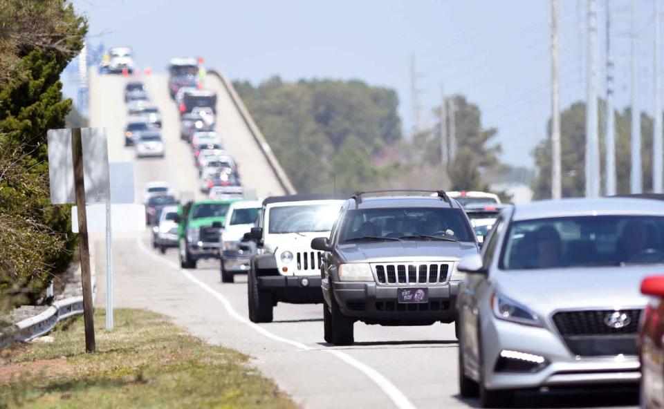 Cars cross the G.V. Barbee Bridge onto Oak Island, N.C., Wednesday, March 28, 2018. The bridge closed in September 2018 for repairs and re-opened in 2019.