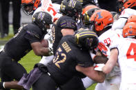 Northwestern running back Cam Porter, left, scores a touchdown during the first half of an NCAA college basketball game against Illinois in Evanston, Ill., Saturday, Dec. 12, 2020. (AP Photo/Nam Y. Huh)