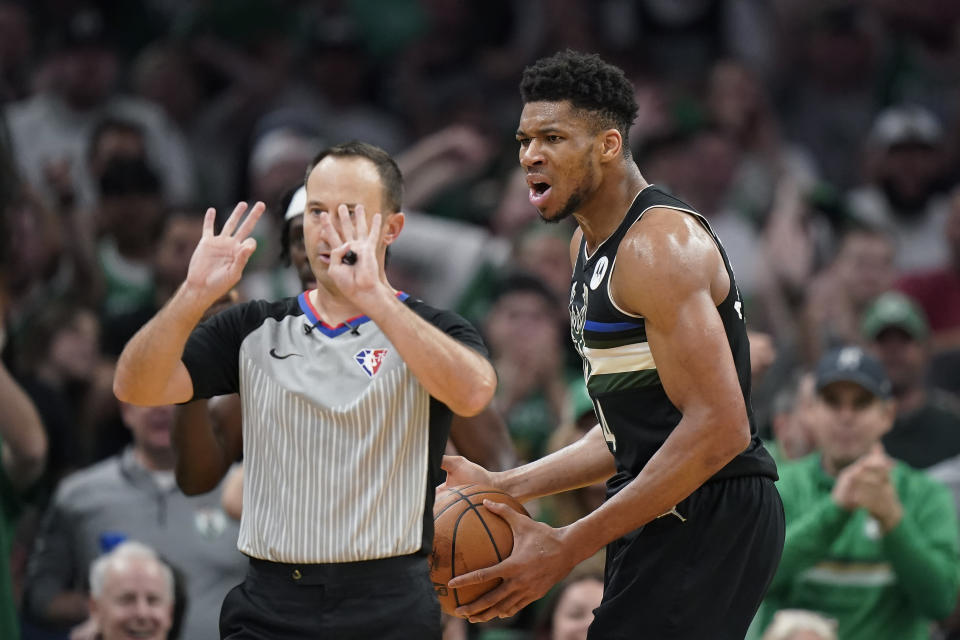 Milwaukee Bucks forward Giannis Antetokounmpo, right, disagrees with a call during the second half of Game 7 of an NBA basketball Eastern Conference semifinals playoff series against the Boston Celtics, Sunday, May 15, 2022, in Boston. (AP Photo/Steven Senne)
