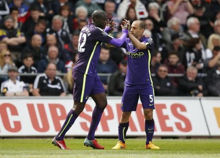 Manchester City's Yaya Toure celebrates scoring their third goal with Pablo Zabaleta. Action Images via Reuters / John Sibley