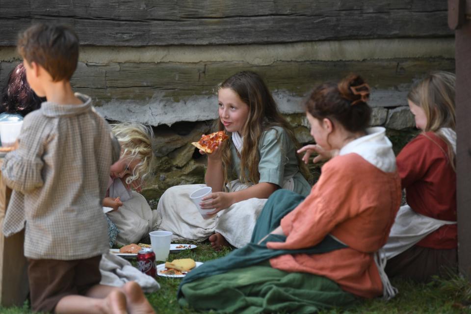 Children enjoy pizza during the Knoxville Historic House Museums’ Statehood Day celebration, Saturday, June 3, 2023.