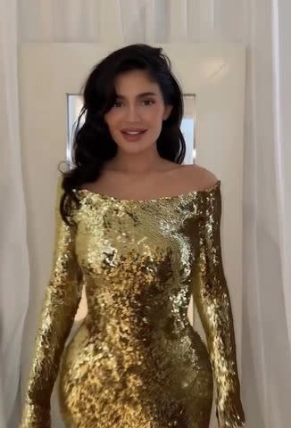 <p>Kylie Jenner/Instagram</p> Kylie Jenner shows off her gold Christmas Eve party look.