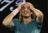 Tennis - Australian Open - Fourth Round - Melbourne Park, Melbourne, Australia, January 20, 2019. Greece’s Stefanos Tsitsipas reacts after winning the match against Switzerland’s Roger Federer. REUTERS/Adnan Abidi