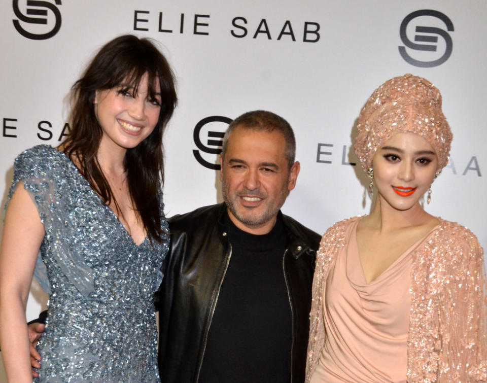 PARIS - MARCH 09:  Daisy Lowe, Elie Saab and Fan Bing Bing attend the Elie Saab: Runway - Paris Fashion Week Fall/Winter 2012 at Espace Ephemere Tuileries on March 9 2011 in Paris, France.  (Photo by Foc Kan/WireImage)