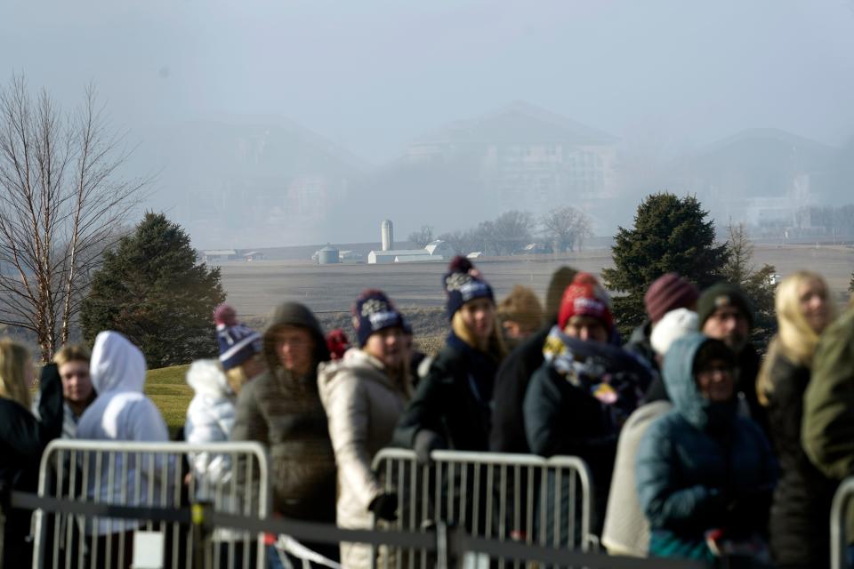 With farmland in the background, people wait to enter a rally with former President Donald Trump at Terrace View Event Center in Sioux Center, Iowa, Friday, Jan. 5, 2024. (AP Photo/Andrew Harnik)