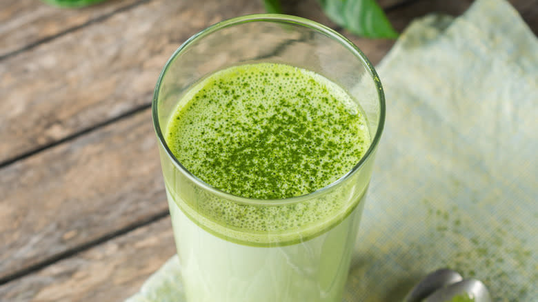 Creamy matcha latte in glass