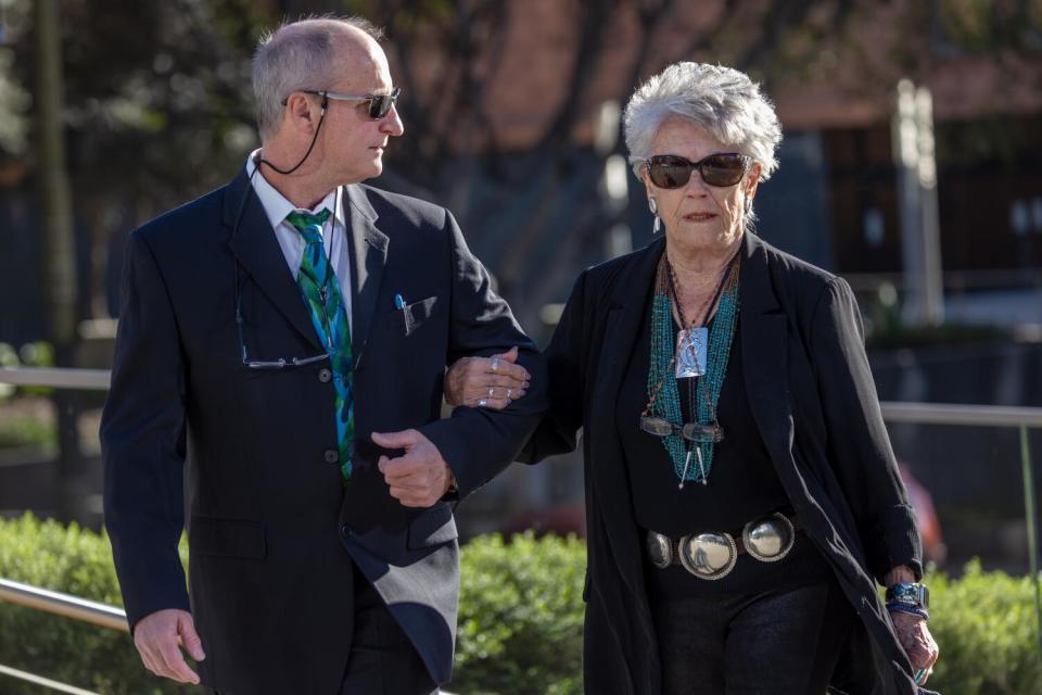 Charles Lynch escorts his mother, Bodine Jones, to the federal court in Los Angeles