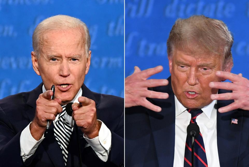 Former Vice President Joe Biden (left) and President Donald Trump meet at the first 2020 presidential debate Tuesday at Case Western Reserve University and Cleveland Clinic in Cleveland, Ohio. (JIM WATSON via Getty Images)