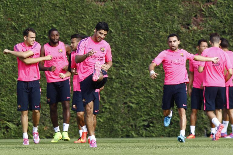 Barcelona's Uruguayan forward Luis Suarez (3rd L) takes part in a training session at the Sports Center FC Barcelona Joan Gamper in Sant Joan Despi, near Barcelona, on August 15, 2014