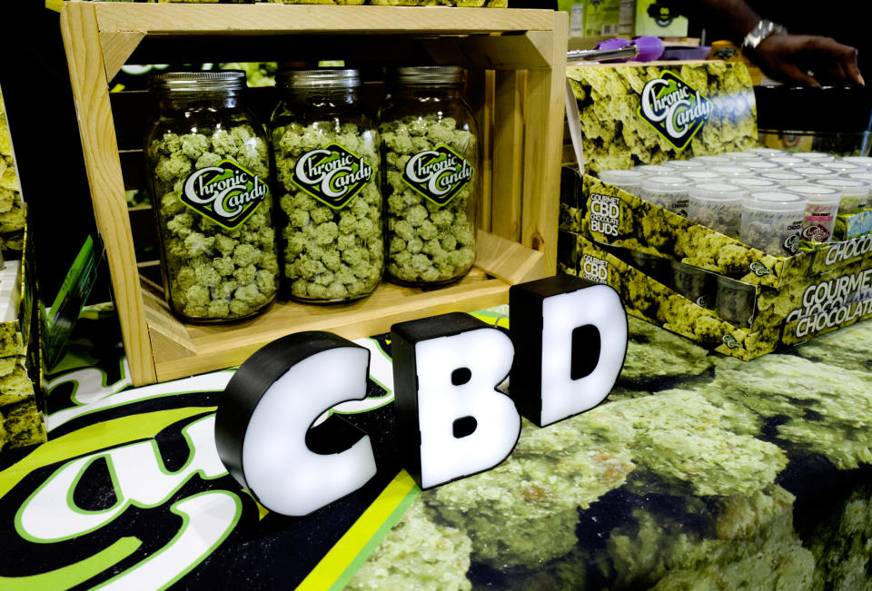 FILE- In this Aug. 31, 2018, file photo CBD buds of chocolate by Chronic Candy are displayed at the Big Industry Show at the Los Angeles Convention Center. From skin-care lotions to bottled water, cannabis companies are rolling out a growing array of consumer products infused with a chemical found in marijuana called cannabidiol, or CBD. (AP Photo/Richard Vogel, File)