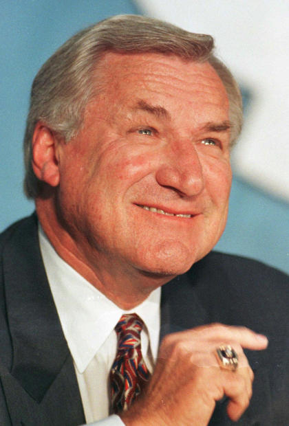 FILE - In an Oct. 9, 1997 file photo, North Carolina basketball coach Dean Smith smiles during a news conference in Chapel Hill, N.C.,where he announced his retirement. Smith, the North Carolina basketball coaching great who won two national championships, died &quot;peacefully&quot; at his home Saturday night, Feb. 7, 2015, the school said in a statement Sunday from Smith&#39;s family. He was 83. (AP Photo/Bob Jordan, File)