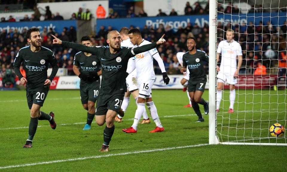 David Silva scored twice in Manchester City`s 4-0 win at Swansea, setting a Premier League record of 15 straight victories.