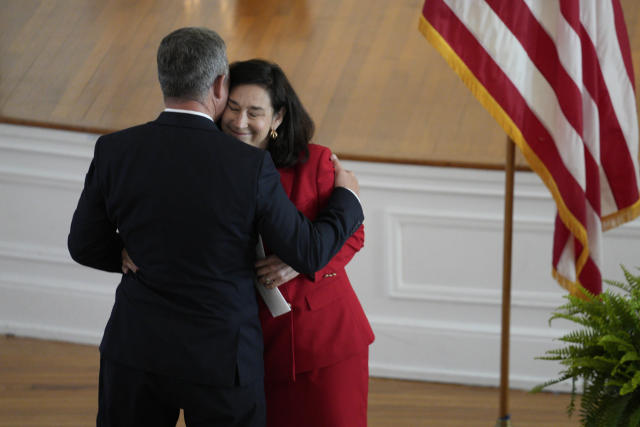 West Virginia gubernatorial candidate Mac Warner, left, embraces wife Debbie Warner at a campaign event at the Charleston Women's Club in Charleston, W.Va., Thursday, May 4, 2023. (AP Photo/Jeff Dean)