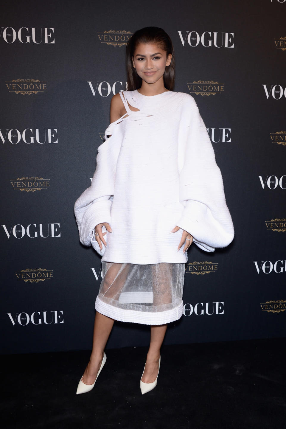 <p>Anyone (or thing for that matter) turning 95 deserves a big party. <i>Vogue Paris </i>just reached the monumental milestone and celebrated the best way it knows how: fashionably. Zendaya, who partied with <a href="https://www.yahoo.com/style/photos/did-rihanna-wear-victorian-nightgown-133214756/gigi-hadid-zendaya-and-kendall-1443965544105.html" data-ylk="slk:Kendall Jenner and Gigi Hadid;elm:context_link;itc:0;sec:content-canvas;outcm:mb_qualified_link;_E:mb_qualified_link;ct:story;" class="link  yahoo-link">Kendall Jenner and Gigi Hadid</a> throughout the night, wore a white coat dress from Katherine Mavridis. The Australian knitwear designer created a piece with one shredded shoulder, oversized sleeves, and a sheer panel on the hemline. </p><p><i>Photo: Getty Images</i><br></p>