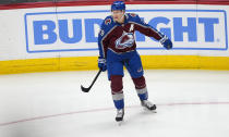 Colorado Avalanche center Nathan MacKinnon reacts after scoring a goal against the Montreal Canadiens during the first period of an NHL hockey game Tuesday, March 26, 2024, in Denver. (AP Photo/David Zalubowski)